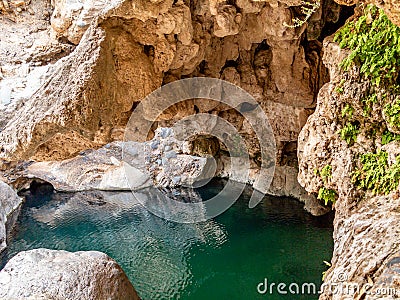 Lagoon in a cave in Wadi near Muscat, Oman Stock Photo