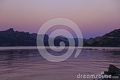 Lagoon, sky and mountains in wonderful sunsets with magical colors. Stock Photo