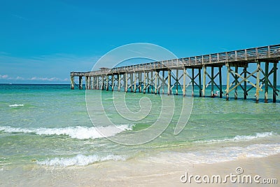 Lagoon and white sandy beach. Sand beach with blue ocean and cloudscape background. Stock Photo