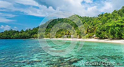 Lagoone and Bamboo Huts on the Beach, Coral Reef of Yananas Homestay Gam Island, West Papuan, Raja Ampat, Indonesia Stock Photo