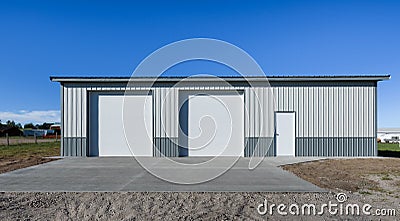 Lagre standing separately, newly built garage in suburb area, USA. Concrete apron, driveway Stock Photo