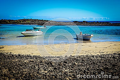 Laguna with white boats at Isla de los Lobos Stock Photo