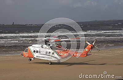 Lahinch, Ireland / OCTOBER 1 2022: Irish coast guard, Sikorsky helicopter, beach rescue mission Editorial Stock Photo