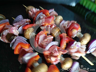 Laid out fresh hand prepared pork skewers Stock Photo