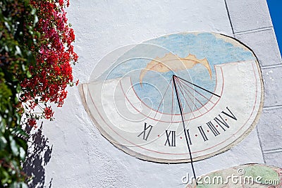 LAION, ITALY - SEPTEMBER 02, 2020: A recently restored sundial painted outside a private house in the town Stock Photo