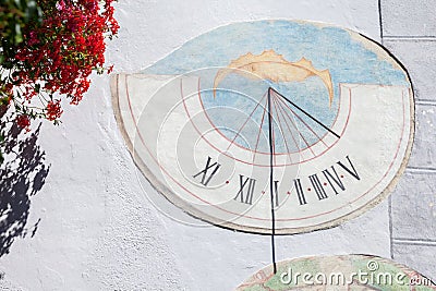 LAION, ITALY - SEPTEMBER 02, 2020: A recently restored sundial painted outside a private house in the town Stock Photo