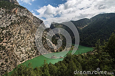 Lake Amongst Forested Mountains Stock Photo