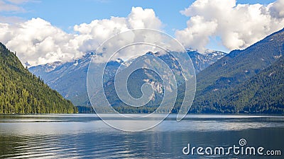 Lake amongst the Mountains with Large Cumulous Clouds Stock Photo