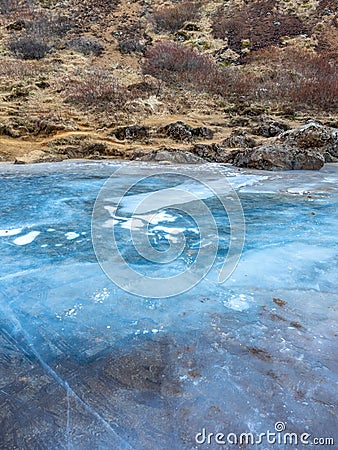 Ice in lake at Kerid crater, Iceland Stock Photo
