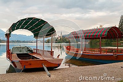 Lake Bled and the island with the church and traditional wooden Stock Photo