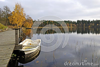 Lake boat harbour in autumn's colors Stock Photo