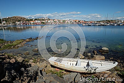 Lake with a Boat an a small village on the other side Stock Photo