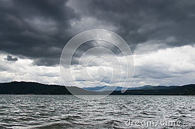 Lake Coeur d' Alene with storm overhead Stock Photo