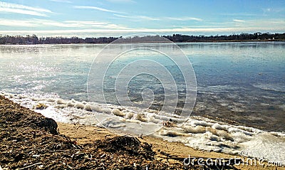 Lake with Frozen Ice along Shore Line Stock Photo
