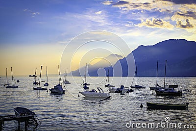 Lake Garda Harbour at sunset with boats Stock Photo