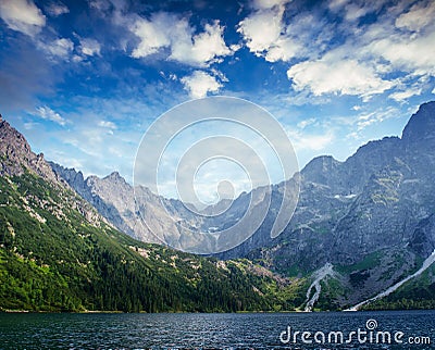 Lake Hallstatt under beautiful white clouds in blue sky. Stock Photo