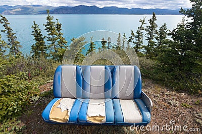 Lake Kluane, Yukon, With Blue Three Seat Couch Stock Photo