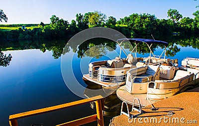 Lake LBJ reflections Pontoon boats on the water Docked Ready for open water Stock Photo