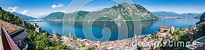 Lake Lugano. Panoramic view of Campione d`Italia, famous for its casino. In the background on the right the city of Lugano Stock Photo