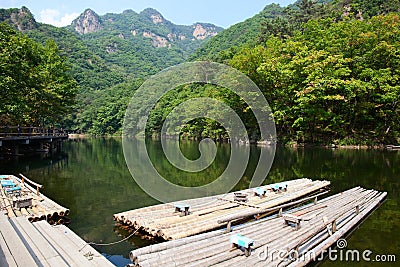Lake, Mountain and Bamboo raft Stock Photo
