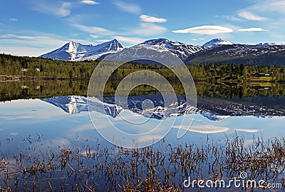 Lake in Norway with snowcapped mountain Stock Photo