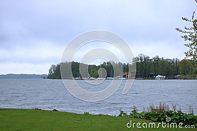 The Lake Schwerin (German: Schweriner See) at the castle and the city on a cloudy day Stock Photo