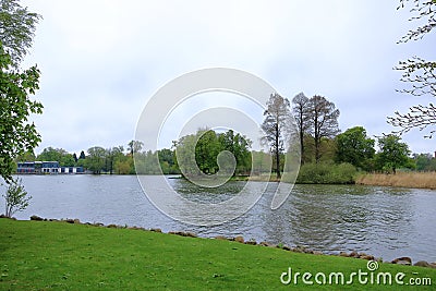 The Lake Schwerin (German: Schweriner See) at the castle and the city on a cloudy day Stock Photo