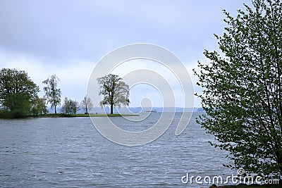 The Lake Schwerin (German: Schweriner See) at the castle and the city on a cloudy day Stock Photo