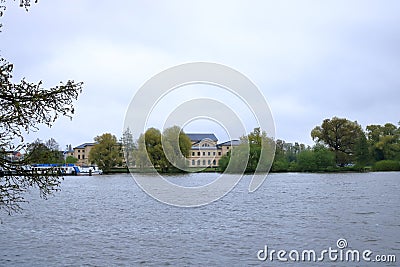 The Lake Schwerin (German: Schweriner See) at the castle and the city on a cloudy day Stock Photo