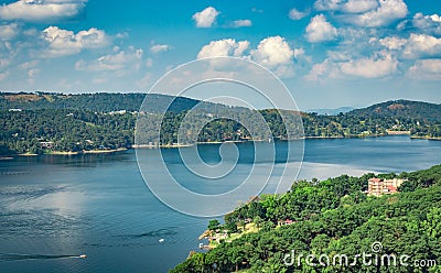 Lake serene blue water with misty mountains aerial image Stock Photo