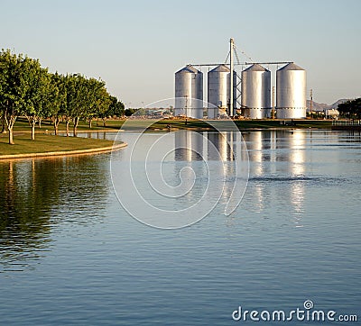 Lake with Silos in the Background Stock Photo