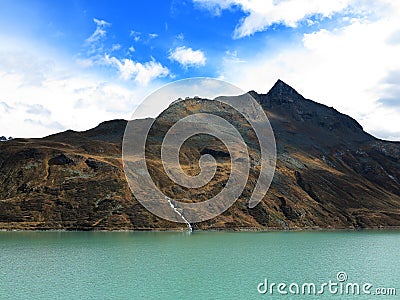 Scenic high alpine mountain lake bluish-green waters Stock Photo