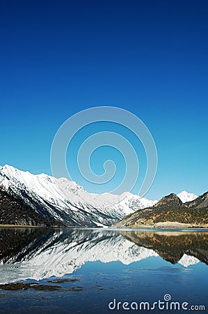 Lake and snow mountains in Tibet Stock Photo