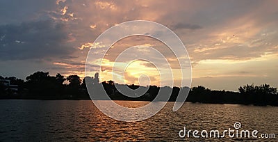 Lake sunset, blue sky burning Stock Photo