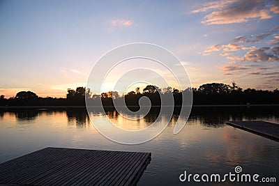 Lake at sunset with orange sky Stock Photo