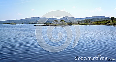 Lake surrounded by hills Stock Photo