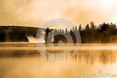 Lake of two rivers algonquin national park ontario canada sunset sunrise with fog foggy mystical atmosphere background Stock Photo