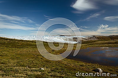 Lake on the way from Point 660 to Kangerlussuaq. Greenlandic icecap in the background Stock Photo