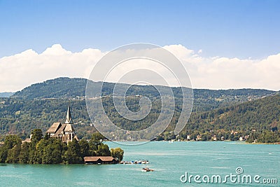 Lake Woerthersee with island and church in Austria Stock Photo