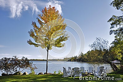The lakefront campfire with Muskoka chairs in a tourist resort in Ontario, Canada Editorial Stock Photo