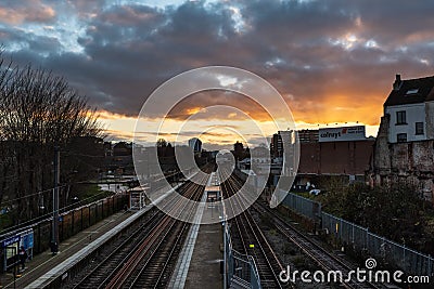 Laken, Brussels Capital Region - Belgium - Colorful clouds over the railway tracks at the local metro and train stop Pannenhuis - Editorial Stock Photo