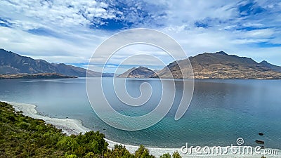 The lakeside beach as you hike along the track heading to Jacks Point in Queenstown Stock Photo