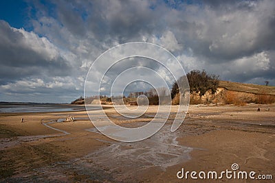 Lakeside beach and cliffs Stock Photo