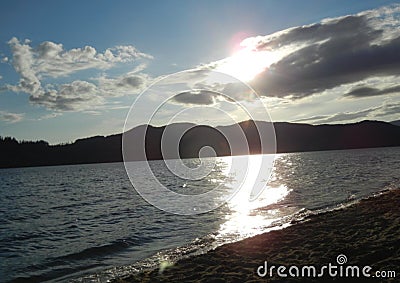 Lakeside clouds at sunset Stock Photo