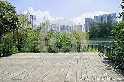 Lakeside fenced viewing platform in city of sunny summer Stock Photo