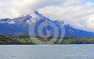Lakeside view of landscape composed of houses, buildings, and trees. Stock Photo