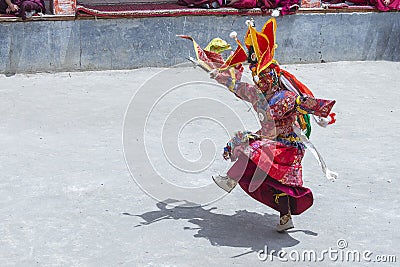 Monk with colored clothes and mask performs Cham dances, ritual dancing at Takthok festival, Ladakh, Lamayuru Gompa, India Editorial Stock Photo