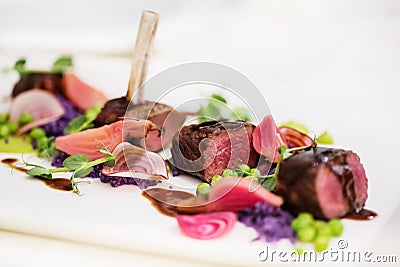 Lamb chops with pea and purple potatoes Stock Photo