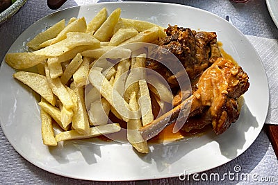 Lamb with crispy fried chips Stock Photo