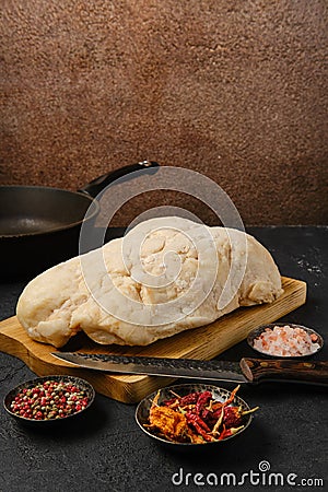 Lamb fat tail on kitchen table Stock Photo